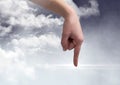 Hand pointing against digitally generated Clouds Royalty Free Stock Photo