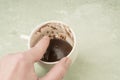 Hand pointing in coffee cup for fortune telling Royalty Free Stock Photo