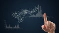 Hand pointing at a digital interface showing a network graph and statistical bar charts Royalty Free Stock Photo
