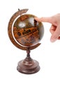 Hand pointing at globe Royalty Free Stock Photo