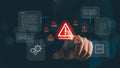Hand pointing at glowing system warning alert with data and AI icons in digital interface, symbolizing cybersecurity risk Royalty Free Stock Photo