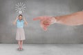 Hand pointing at happy business woman against grey background with a bulb icon Royalty Free Stock Photo