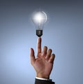 Hand pointing Light bulb Royalty Free Stock Photo