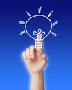 Hand pointing light bulb Royalty Free Stock Photo