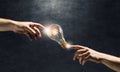 Hand pointing light bulb Royalty Free Stock Photo