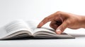 Hand Pointing at Open Book Royalty Free Stock Photo