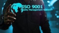 Hand pointing to the world image and ISO9001 quality management system
