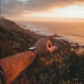 Hand Pointing Towards the Ocean at Sunset Royalty Free Stock Photo