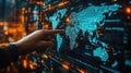 A hand pointing at a world map on a digital screen, a business global technology concept Royalty Free Stock Photo