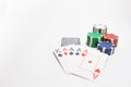 Hand of poker, four aces, chips on white background Royalty Free Stock Photo