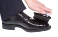 Hand polishing black shoe Royalty Free Stock Photo