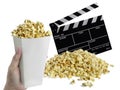 Hand with Popcorn, Movie clapperboard isolated on white