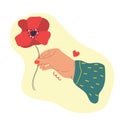 Hand with poppy flower