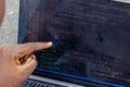 Hand portrait of african web developer pointing finger at line of computer code