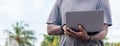 Hand portrait of an African web developer working with his laptop, with a smartwatch Royalty Free Stock Photo