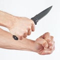 Hand position to attack with a army knife on white background Royalty Free Stock Photo
