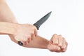 Hand position to attack with a knife on white background Royalty Free Stock Photo
