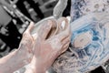 Hand of the potter and the child in the creation Royalty Free Stock Photo