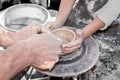 Hand of the potter and the child in the creation Royalty Free Stock Photo