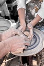 Hand of the potter and the child in the creation Royalty Free Stock Photo