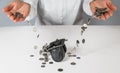 Hand pour coins falling out in wallet Royalty Free Stock Photo