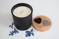 Hand-poured scented soy candle in black aura vessel.