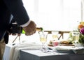 Hand Pouring Filling Champagne Drink to Glasses Royalty Free Stock Photo