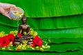 Hand pouring holy water for blessing and pray respects to Buddha statue when Thailand Songkran Festival day Royalty Free Stock Photo