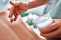 Hand pouring oil for massage in spa Royalty Free Stock Photo