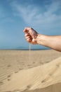 Pouring sand from a hand at Tarifa Royalty Free Stock Photo