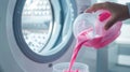 Hand Pouring Pink Detergent.AI generated image Royalty Free Stock Photo