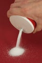 Hand pouring salt