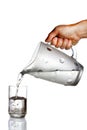 Hand pouring water from glass jug Royalty Free Stock Photo