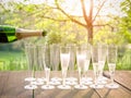 Hand pouring wine into flute glasses of champagne Royalty Free Stock Photo