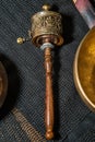 Hand prayer wheel and Tibetan Singing bowls Royalty Free Stock Photo