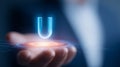 Hand presenting a holographic letter U above a digital interface representing user experience and virtual identity. Royalty Free Stock Photo