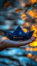 Hand presenting a paper boat with the message Welcome aboard against a blue background, symbolizing new beginnings and