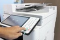 Hand press button on the panel printer office laser scanner printer Royalty Free Stock Photo