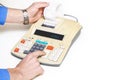 Hand presses cash register keys another takes out check Royalty Free Stock Photo