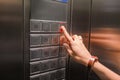 hand presses on the elevator lift button Royalty Free Stock Photo
