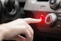 The hand presses the emergency stop button in the car. Close up Royalty Free Stock Photo