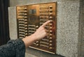 Hand presses the intercom button Royalty Free Stock Photo