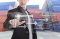 hand presses Logistics text icon on screen with Industrial Container Cargo yard background (Elements of this image furnished by N