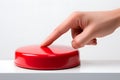 A hand presses a red button on a white background, symbolizing the nuclear strike concept. Royalty Free Stock Photo