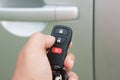 Hand presses on the remote control car alarm Royalty Free Stock Photo