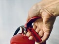 hand presses the trigger fire extinguisher Royalty Free Stock Photo