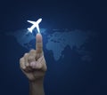 Hand pressing airplane button over digital world map blue background, Airplane transportation concept, Elements of this image fur Royalty Free Stock Photo