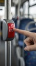 Hand pressing bus stop button closeup Royalty Free Stock Photo