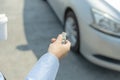 Hand pressing button remote to lock or unlock a car Royalty Free Stock Photo