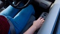 Hand pressing a car window lock button. driver is pressing buttons of window switches with remote control inside modern car, Royalty Free Stock Photo